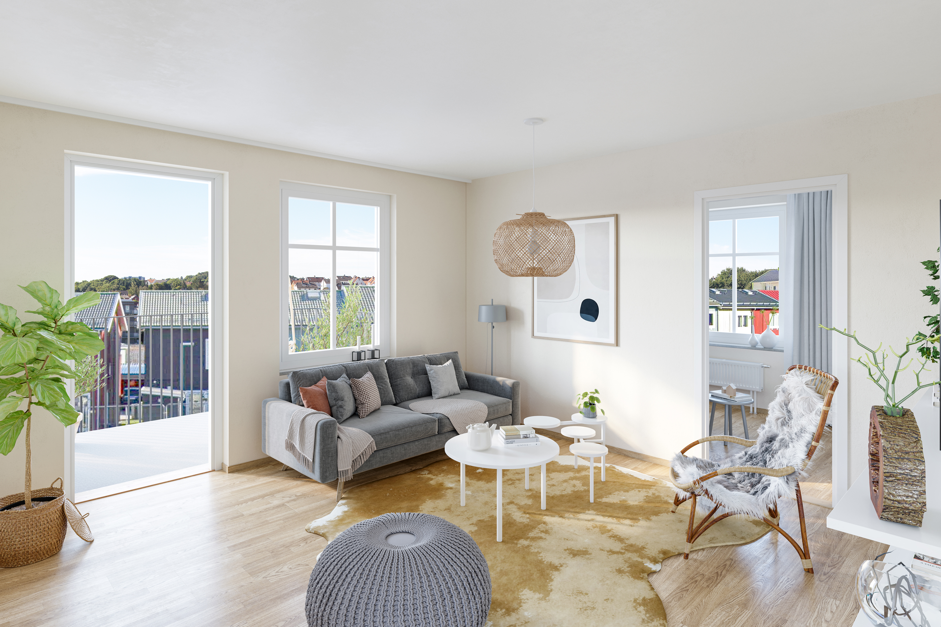 Vardagsrum i vitt med ekparkettgolv inrett med grå soffa, vitt bord, fåtölj och grå puff.